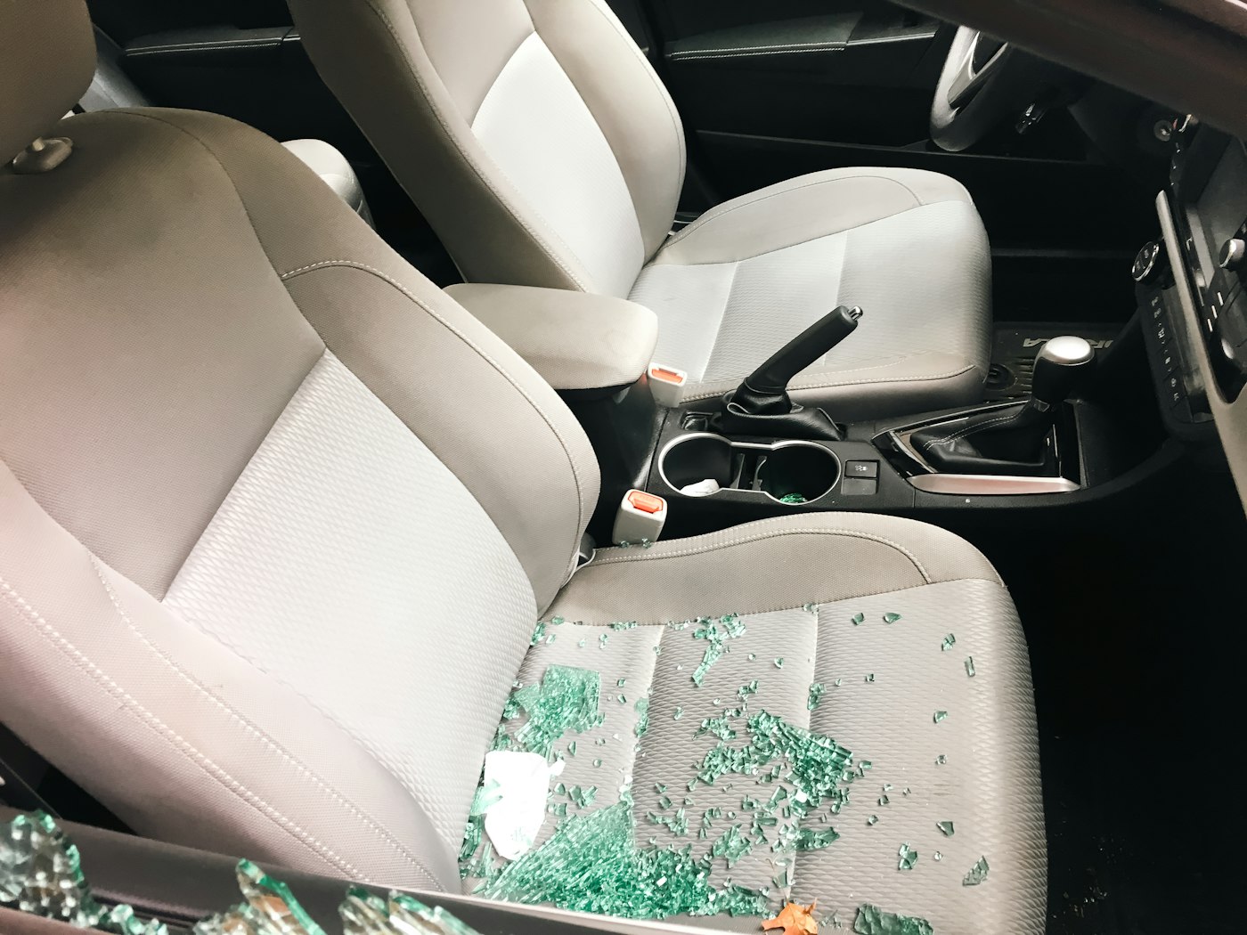 Shattered side window glass inside a vehicle